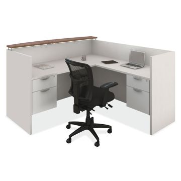 L-shaped reception desk with transaction shelf.