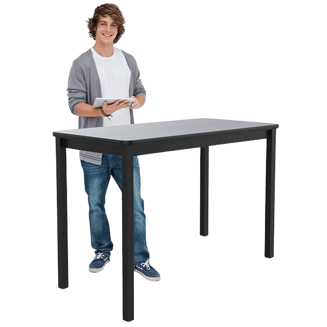 Student stands at a working height science table with a white background. 